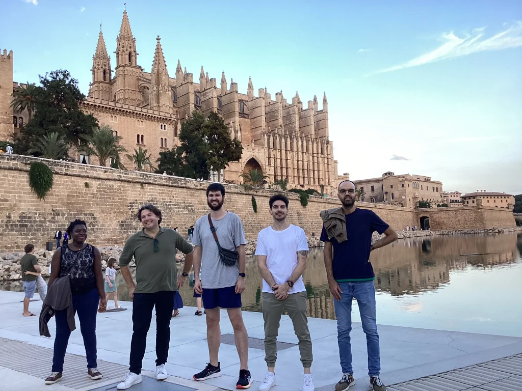 Team taking a photo in front of La Seu in Palma de Mallorca during Urban Escape activity